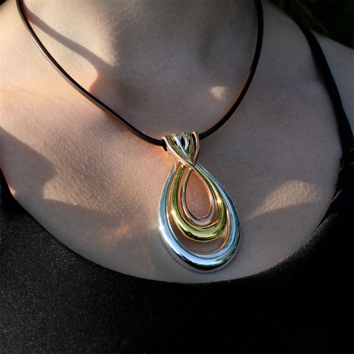 Elegant Tri-Tone Teardrop Pendant Necklace with Black Cord - Fashion Statement Jewelry