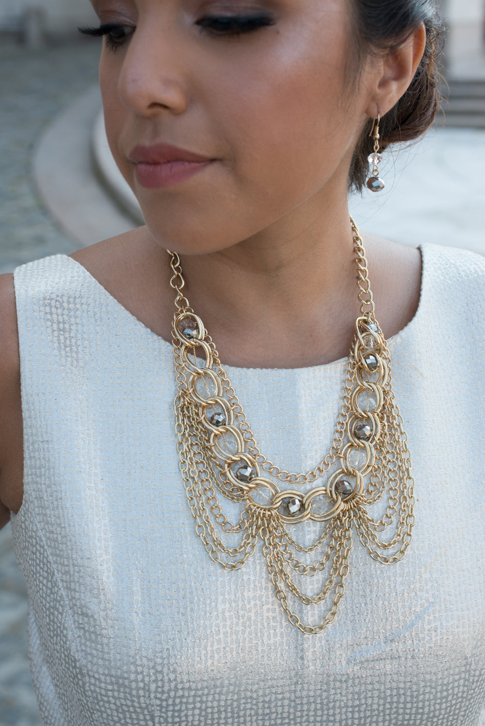 Elegant Gold Tone Crystal Bib Statement Necklace with Draped Chains and Matching Earrings