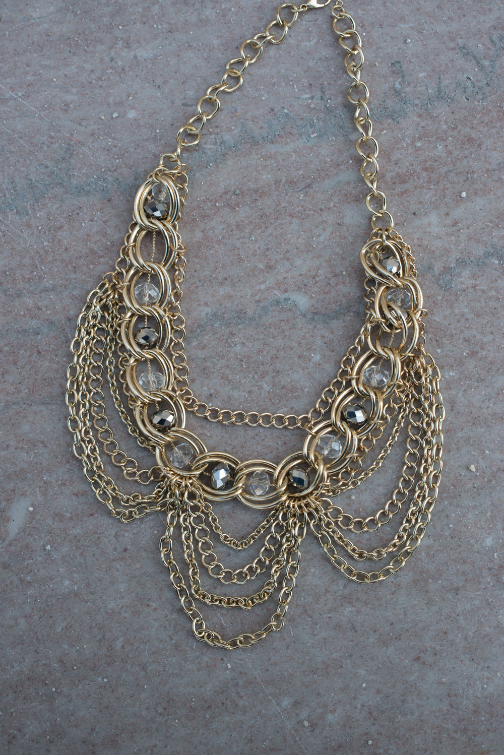 Elegant Gold Tone Crystal Bib Statement Necklace with Draped Chains and Matching Earrings