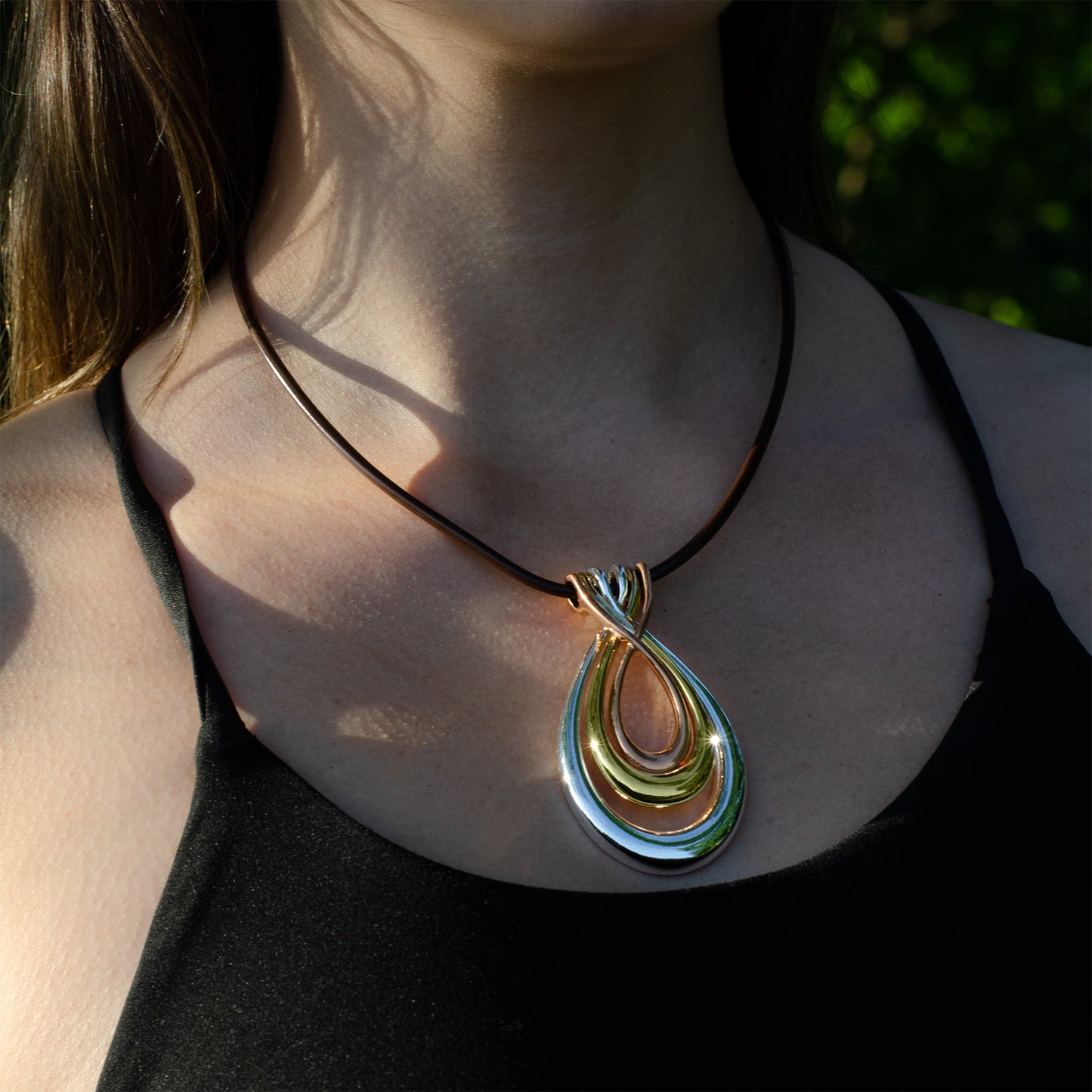 Elegant Tri-Tone Teardrop Pendant Necklace with Black Cord - Fashion Statement Jewelry
