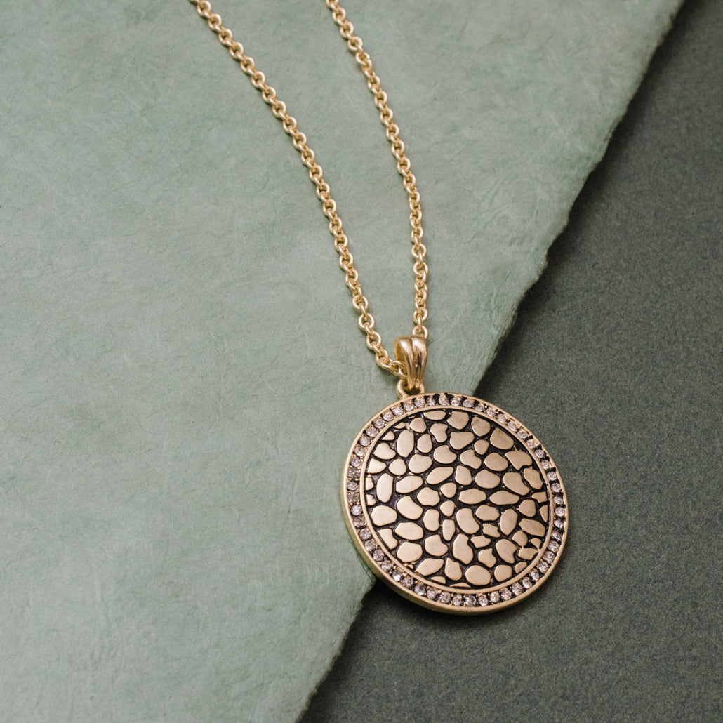 Gold Tone Textured Circle Pendant Necklace with Crystal Rim, 17 Inch Chain with 3 Inch Extender