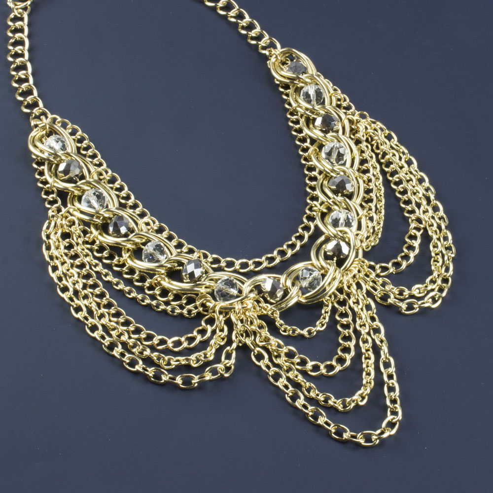Elegant Gold Tone Crystal Bib Statement Necklace with Draped Chains and Matching Earrings