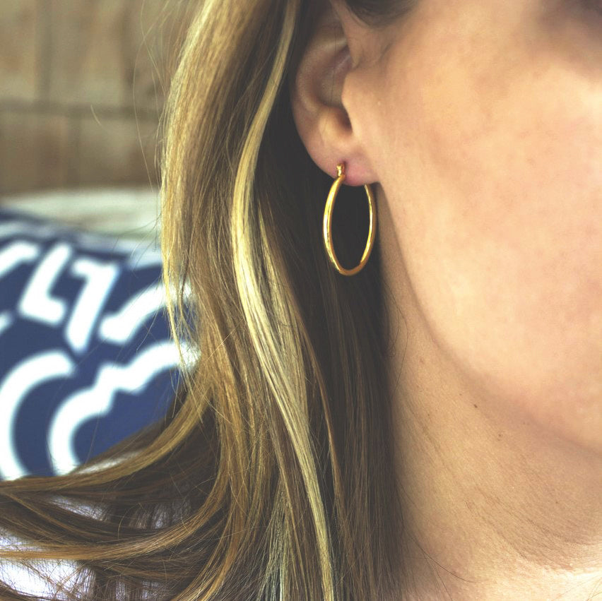 Classic Gold Tone Oval Hoop Earrings with Latch Back Closure - 1.25 Inch