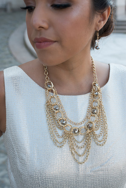 Elegant Gold Tone Crystal Bib Statement Necklace with Draped Chains and Matching Earrings